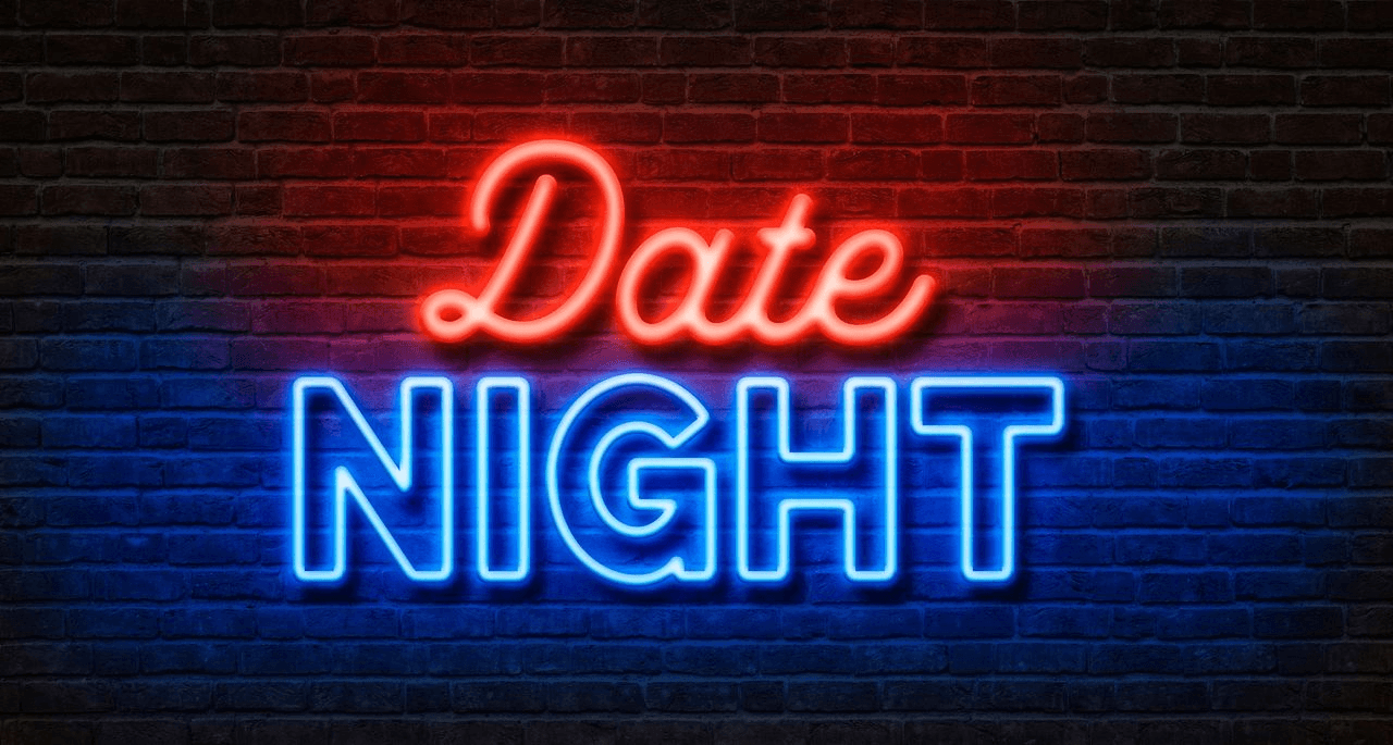 Red and blue Date Night neon sign glowing against a brick wall